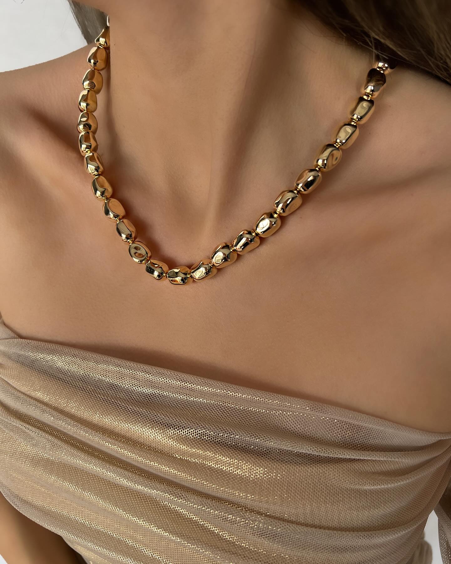 Chunky square gold beads, a bold necklace that makes a modern statement.