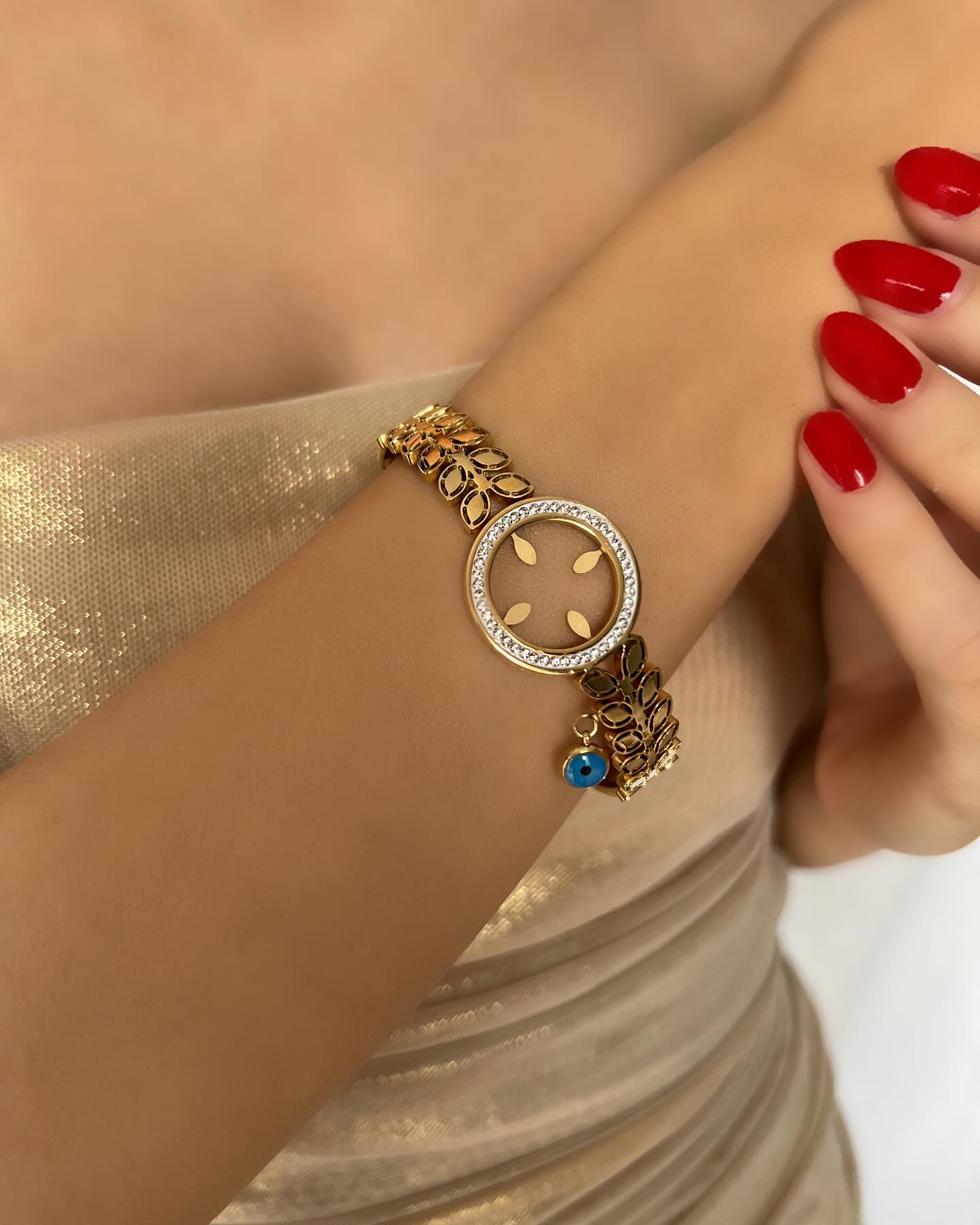 Wide circular compass design with diamond accents, a striking bracelet that symbolizes direction and elegance.