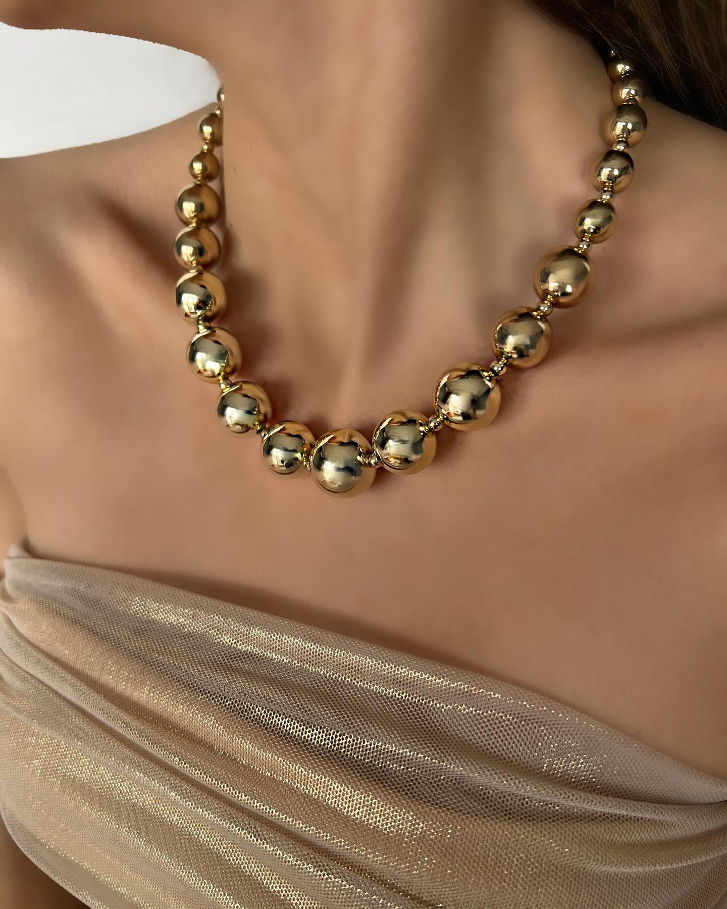 Bold gold beaded design, a statement necklace that elevates any look