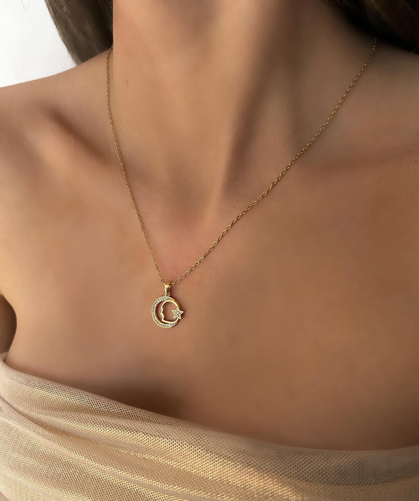 Moon and star charm, a celestial necklace that shines with elegant simplicity.