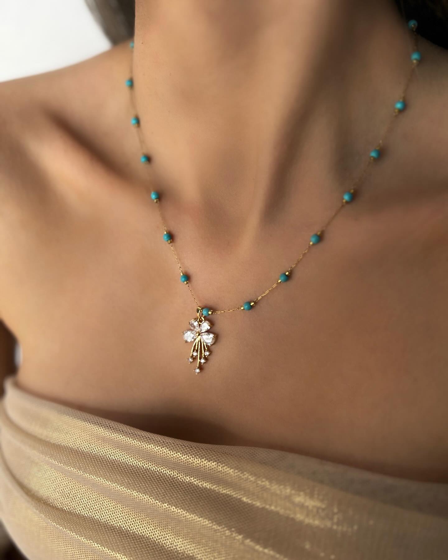 Blue beaded design with a diamond gift charm, a playful necklace that sparkles with charm and joy.