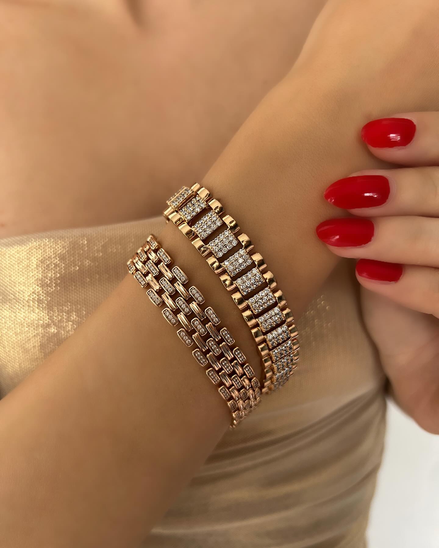 Two gold bracelets with notched and diamond details, a sophisticated duo that adds radiant elegance.