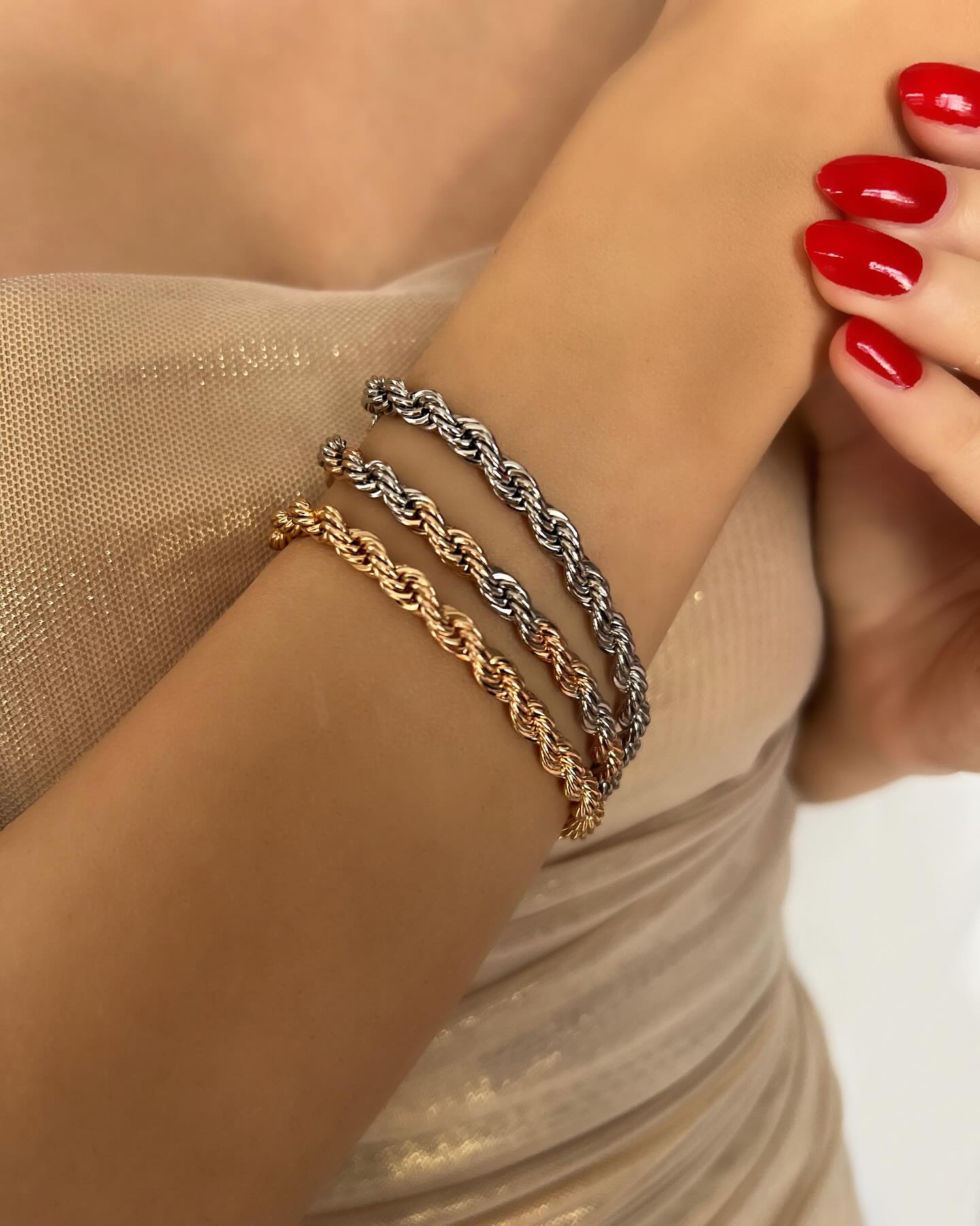 Triple twisted design in gold and silver tones, a chic bracelet set that blends classic and modern style.