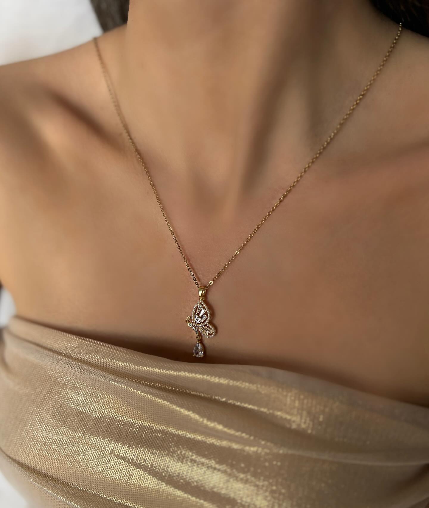 Butterfly charm with diamond accents, a delicate necklace that captures grace and feminine elegance.