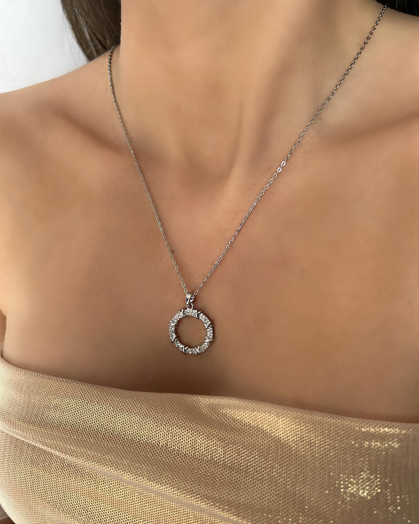 Circle design with diamond accents, a timeless necklace that shines with elegant simplicity.