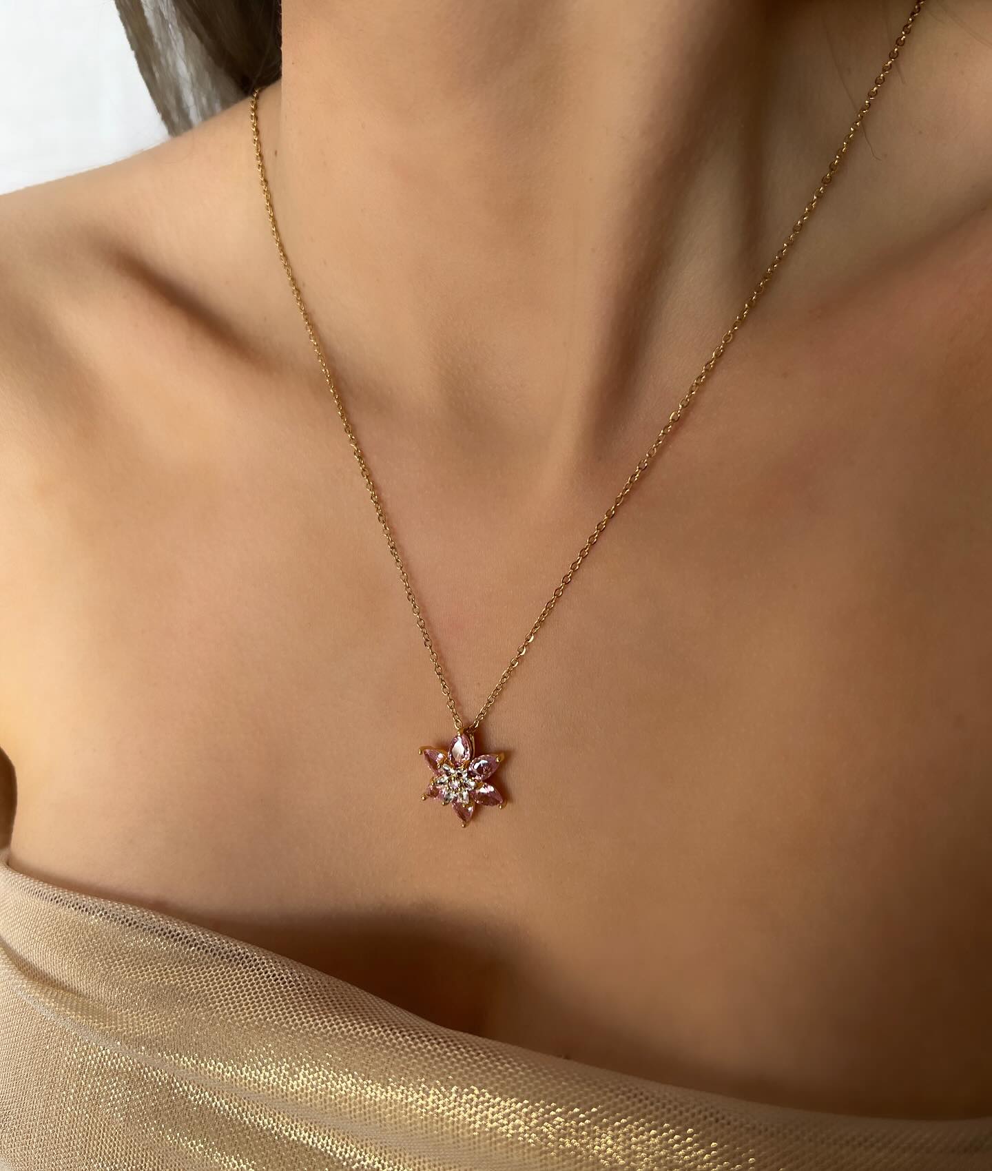 Diamond-accented star pendant design, a celestial necklace that sparkles with radiant elegance.
