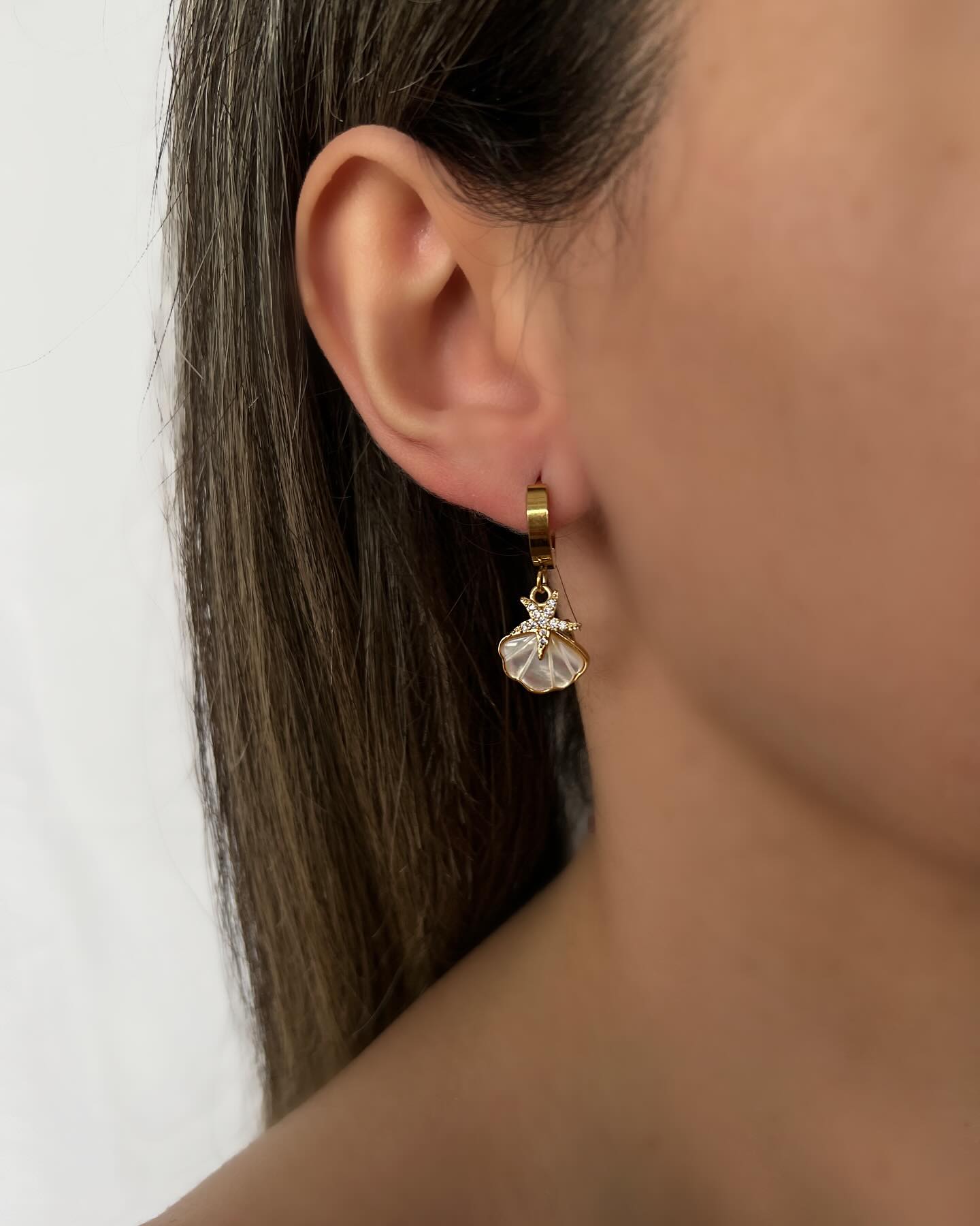 Seashell and starfish pendant design, a coastal pair of earrings that captures ocean-inspired charm.
