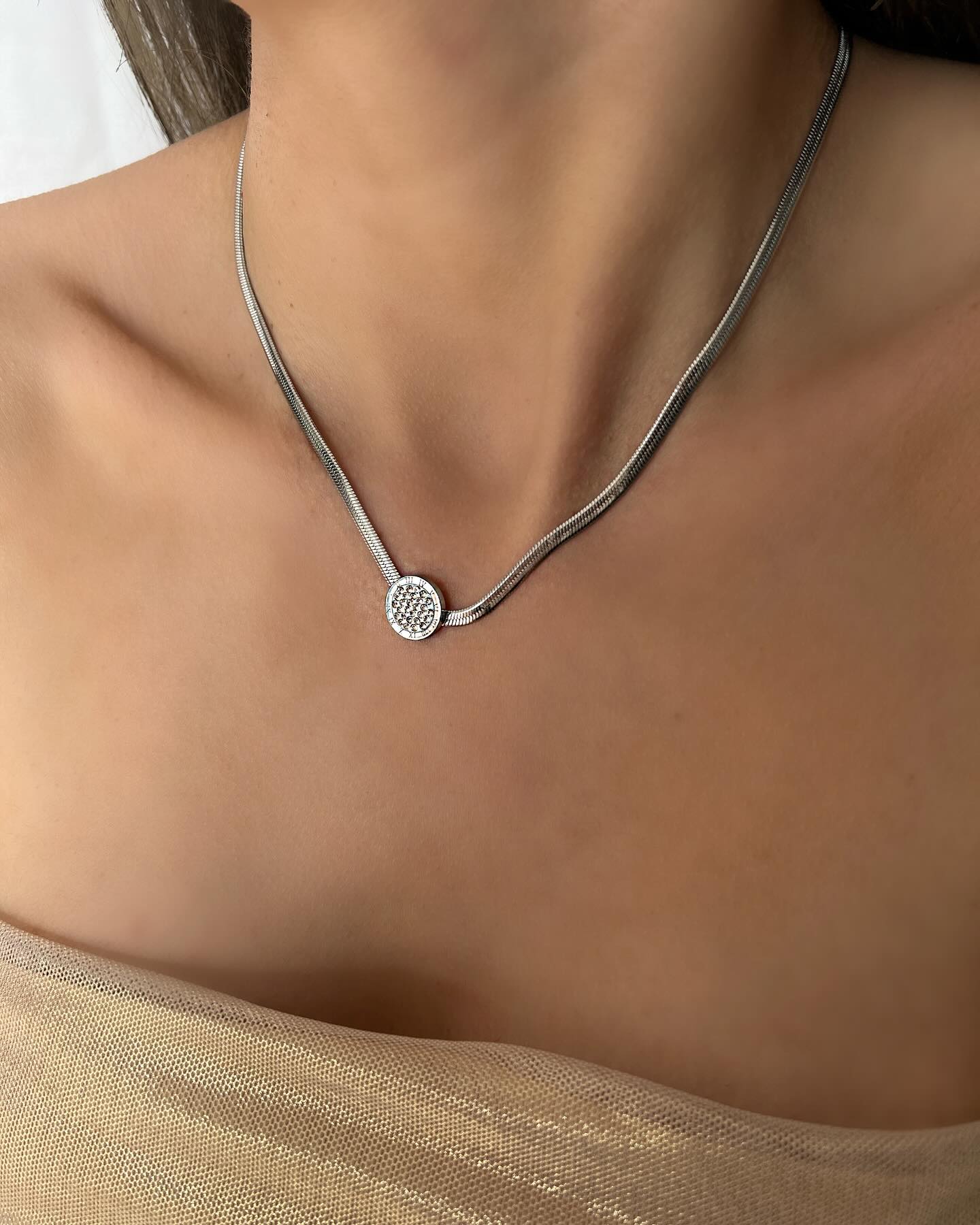 Silver Roman numeral design with diamond accents, a timeless necklace that blends classic elegance with modern sparkle.