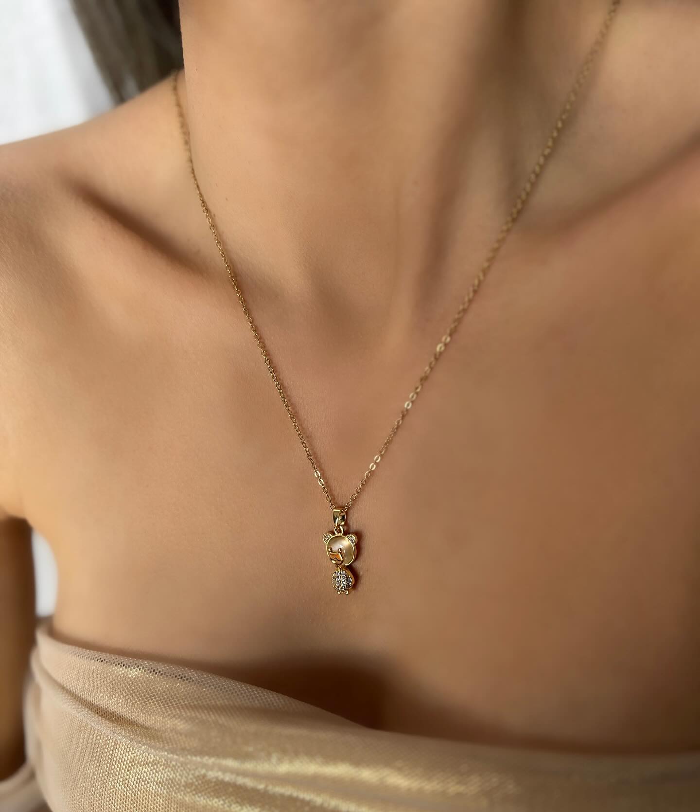 Bear charm with diamond accents, a charming necklace that combines playful style with delicate sparkle.