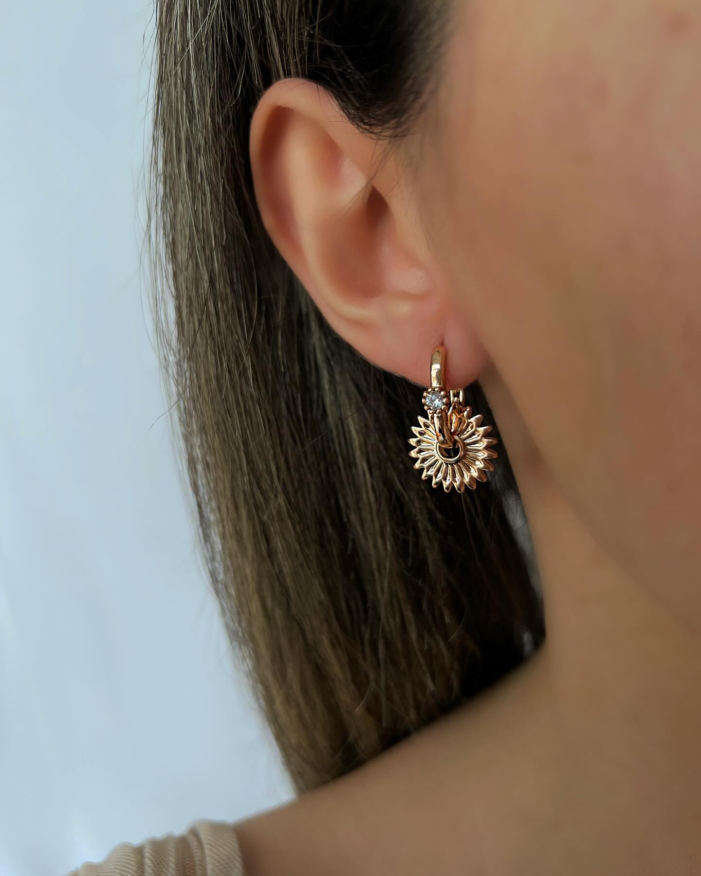 Pointed-tip design with small stones, a chic pair of earrings that adds subtle sparkle and edge.