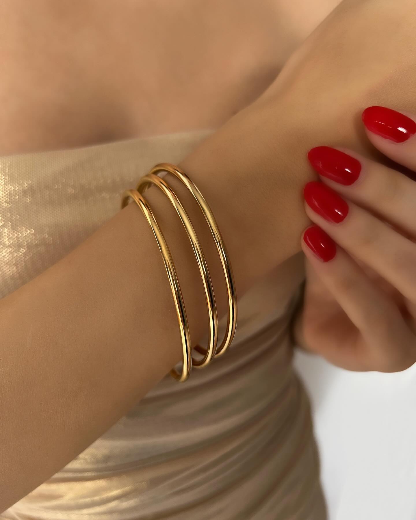 Triple gold love bangle design, a classic bracelet set that embodies sophistication and everlasting style.